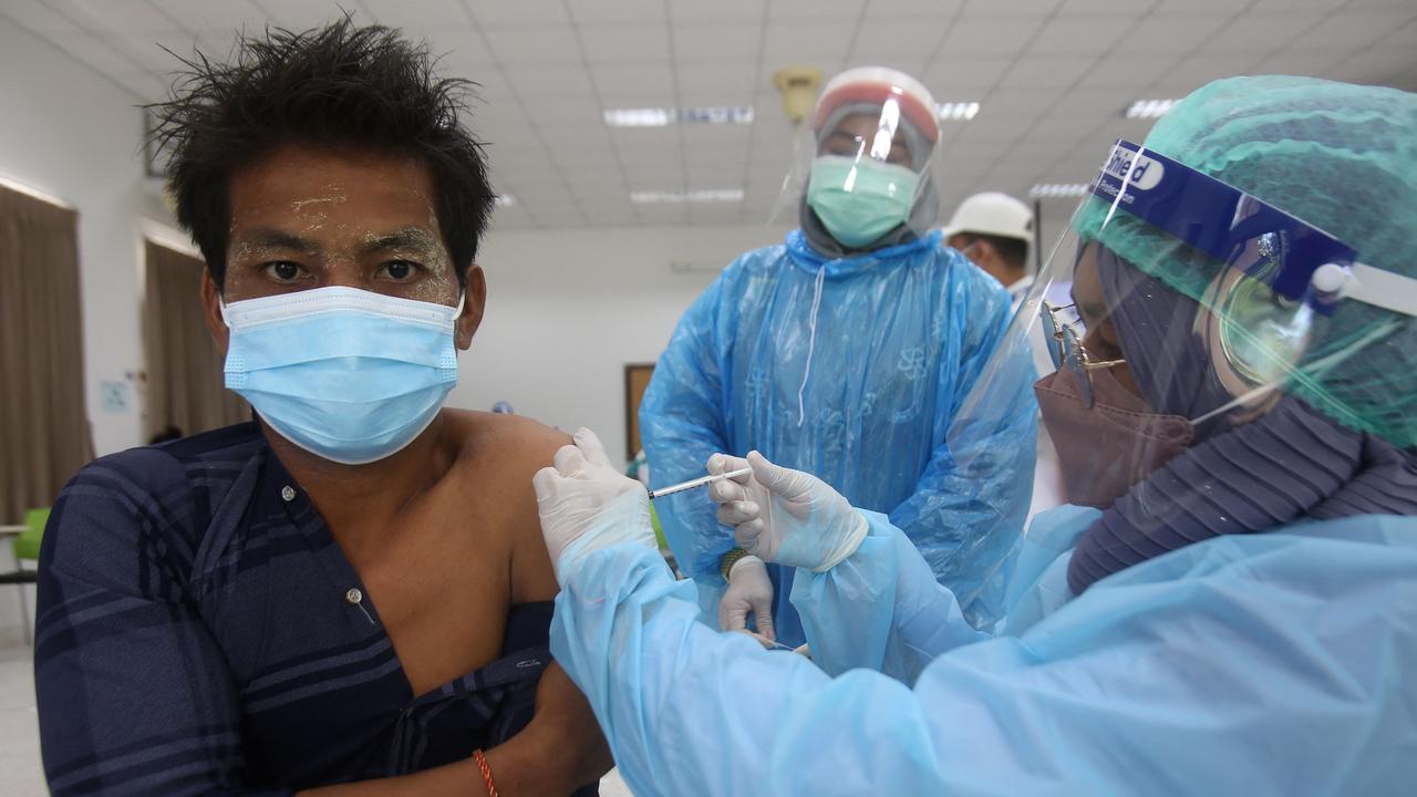 A healthcare worker in Thailand receiving the Sinovac vaccine. (Photo by Tuwaedaniya Meringing/AFP