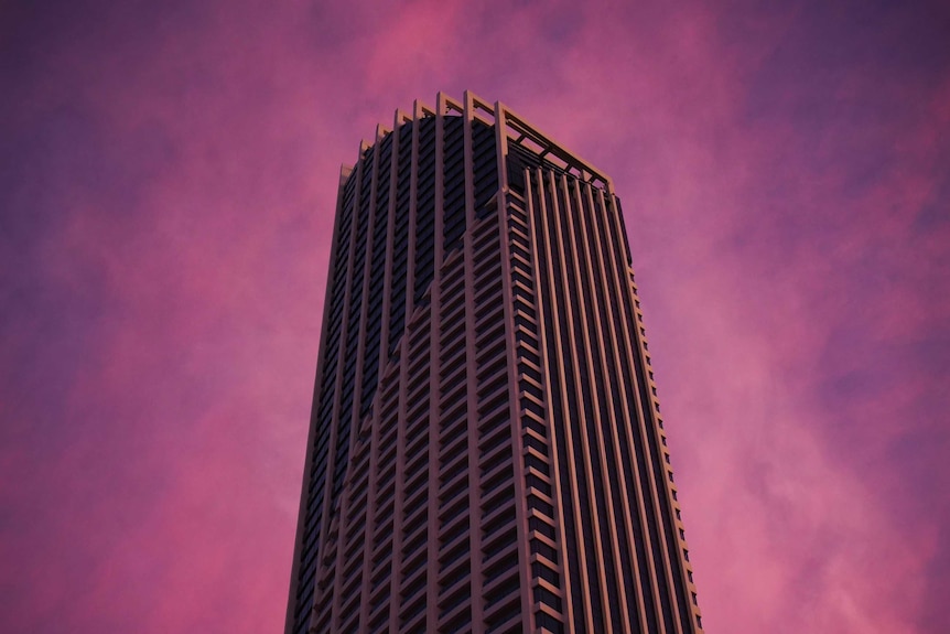 A large residential tower at sunset.
